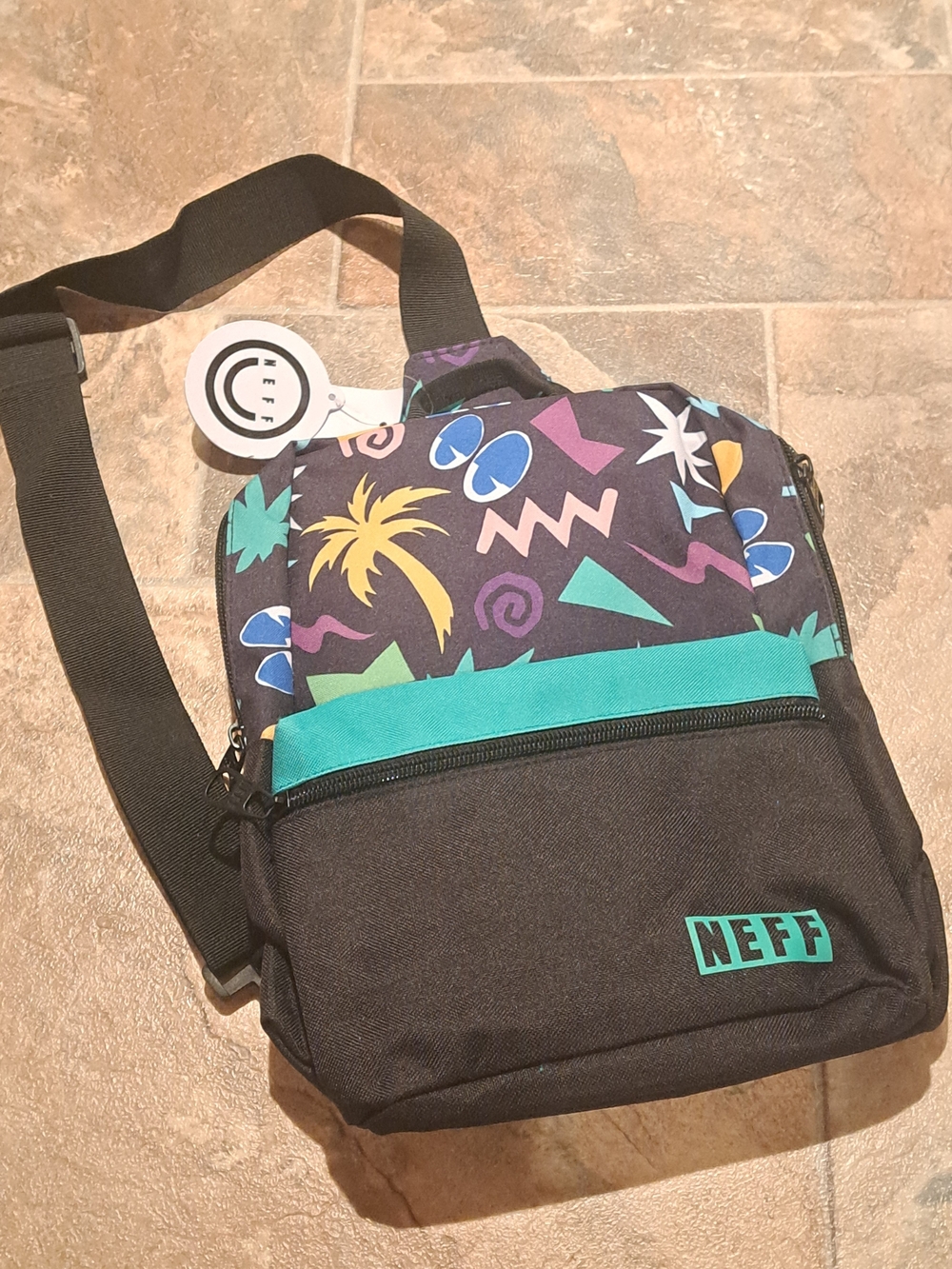 New Neff Black Crossbody Bag with Teal Trim and Multicolor Print